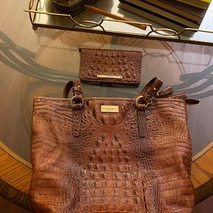 Loved tote bag with wallet. This a roomy bag great for work and travel.